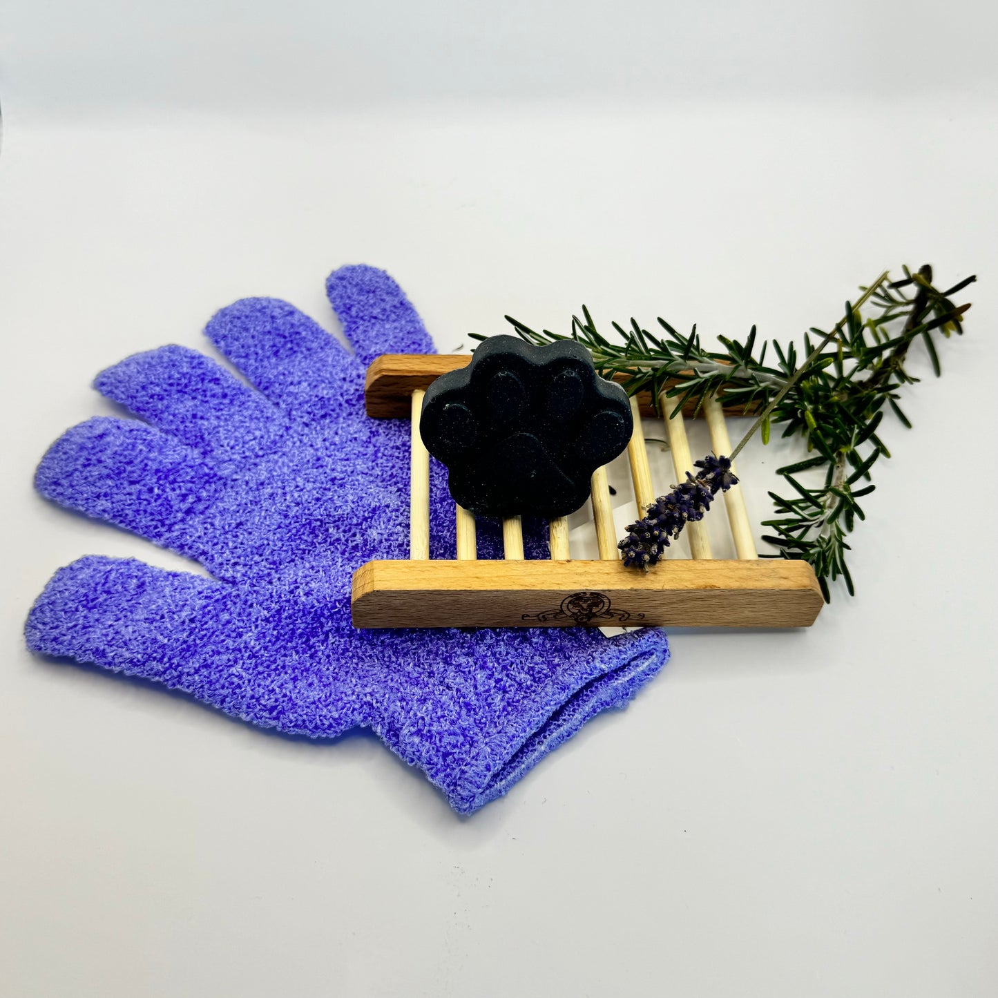 activated charcoal shampoo bar, purple exfoliating glove. Lavender and Rosemary